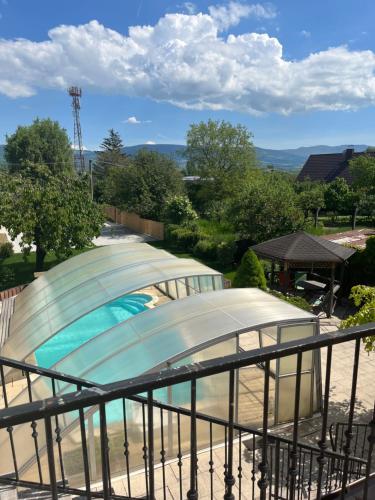 a large swimming pool with a domed building at Vila pri kúpeľoch in Bojnice