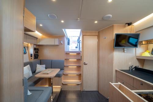 a small kitchen and living room in a caravan at GreRos Yacht by ClaPa H.&G Group in Naples