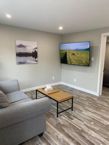 a living room with a couch and a coffee table at ENTIRE 1 BEDROOM APARTMENT DOWNTOWN - u4 in Waterloo