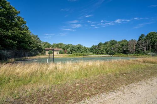 a tennis court in the middle of a field at The Sanctuary - Halfway point between South Haven and Saugatuck - Walking distance to Lake Michigan in Glenn