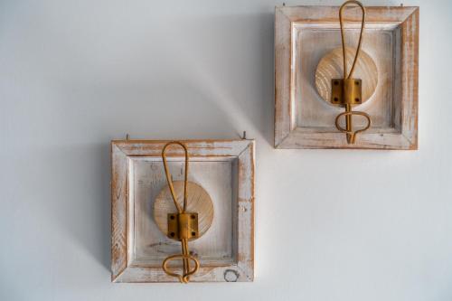 two lights are hanging on a wall at Villa Giulia - Vesuvio Guest House Pompei Sorrento in Boscotrecase