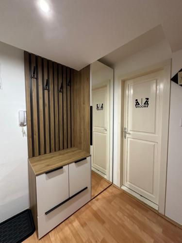 a room with a closet and two doors at Čarapan in Kruševac