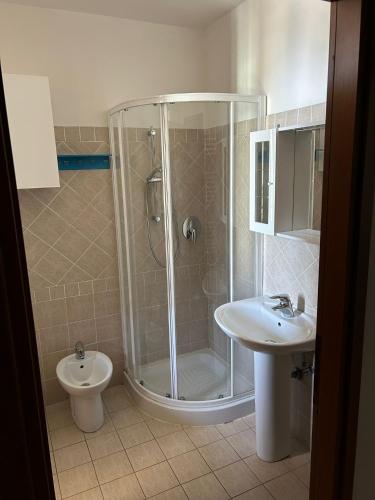 a bathroom with a shower and a toilet and a sink at Monolocale a Castel Bolognese in Castel Bolognese