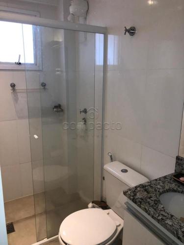 a bathroom with a shower and a toilet and a sink at Apartamento todo mobiliado - Completo! in Sao Jose do Rio Preto