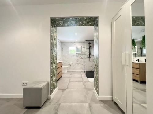 a bathroom with a mirror and a walk in shower at Casona LOW COST Fan Lujo in Palma de Mallorca