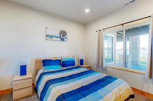 Ένα ή περισσότερα κρεβάτια σε δωμάτιο στο Beach Front Haven