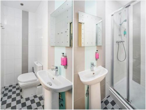 a bathroom with a toilet and a sink and a shower at stay in in New Delhi