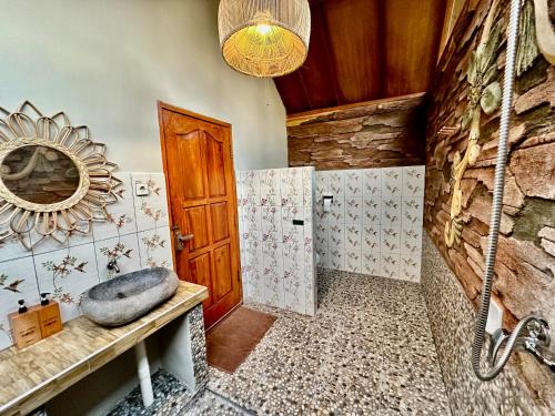 a bathroom with a sink and a mirror at Sunny Rose Bungalows Gili Air - Adults only in Gili Air