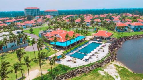 an aerial view of a resort with a swimming pool at Ocean Beach Resort Da Nang in Da Nang