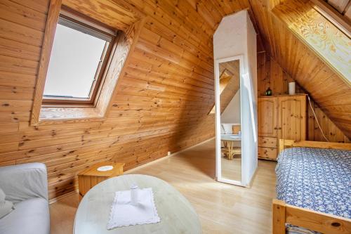 a room with a bed and a table and a window at Ferienwohnung Kappeln - Kiekut 11 in Kappeln