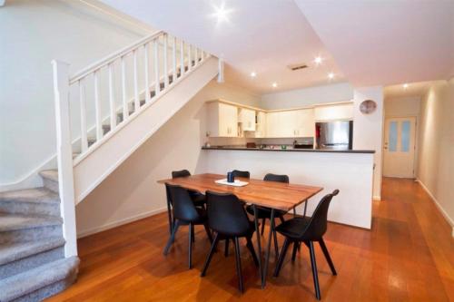 a kitchen and dining room with a table and chairs at Norwood Saltbush Retreat With Wifi in Norwood