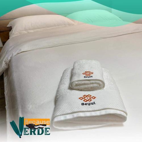 Säng eller sängar i ett rum på Because Verde Resort