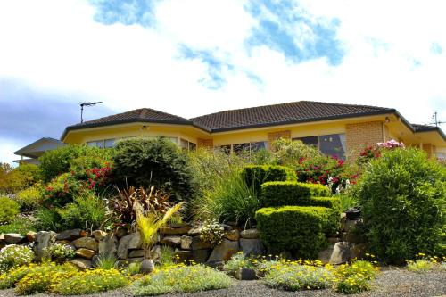 a house with a garden in front of it at "Villa Marie"- Pet-Friendly in Encounter Bay