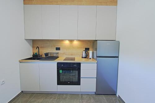 Kuchyň nebo kuchyňský kout v ubytování Guesthouse Viktorija Flat - Deluxe Apartment