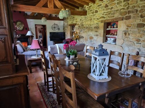 a living room with a wooden table and chairs at Gaztañeta Baserria in Olaeta
