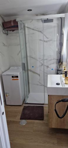 a bathroom with a shower with a sink and a counter at Luxury Studio Costa del Sol in Torremolinos