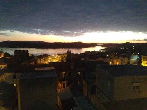 a view of a city with the sunset in the background at Krka Ivan in Lozovac