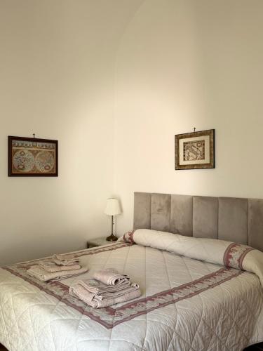 a bedroom with a bed with a blanket on it at B&B La Meta in Benevento