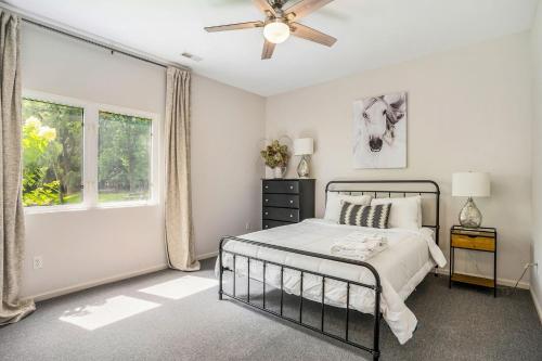 a bedroom with a bed and a ceiling fan at Lily Pond Haven - Private Hot tub - Large recently remodeled home! in Glenn
