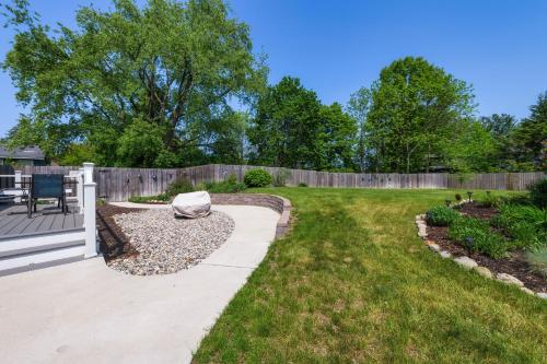 a backyard with a fence and a patio at Garden Getaway - Walking Distance to downtown Douglas - Cute Home! in Douglas