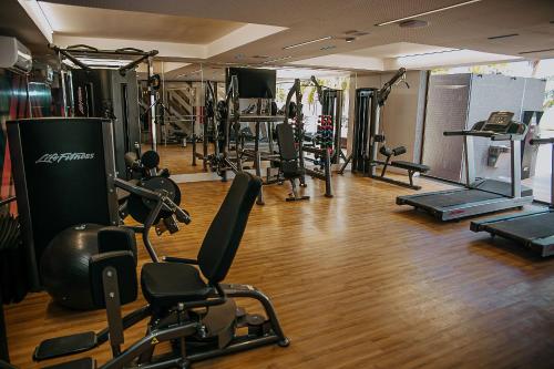 a gym with several treadmills and exercise machines at Unity #421 - Praia de Cabo branco por Carpediem in Penha