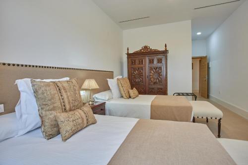 A bed or beds in a room at Finca La Fuensanta