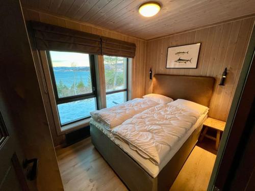 Postelja oz. postelje v sobi nastanitve Fjord-Holiday-Lodge mit atemberaubendem Panorama