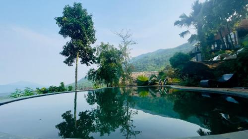 a swimming pool with a view of a mountain at Pu Luong Paradise in Hương Bá Thước