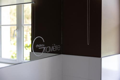 a box on top of a counter next to a window at Château La Gravière in Vertheuil-en-Médoc