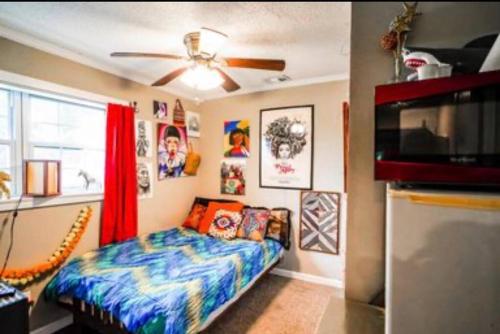 a bedroom with a bed and a ceiling fan at Hilltop Hideaway 2 in Atlanta