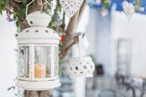 a white lantern hanging from a tree at Villa Giulia - Vesuvio Guest House Pompei Sorrento in Boscotrecase
