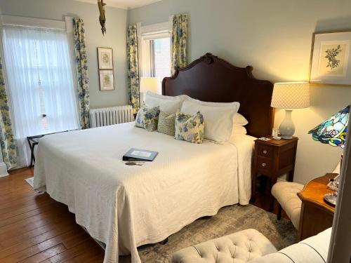 a bedroom with a bed with a book on it at Lamberson Guest House in Galena