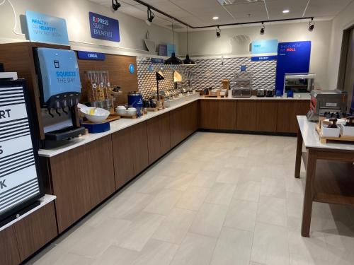 a store with a counter with a food at Holiday Inn Express & Suites Elyria, an IHG Hotel in Elyria