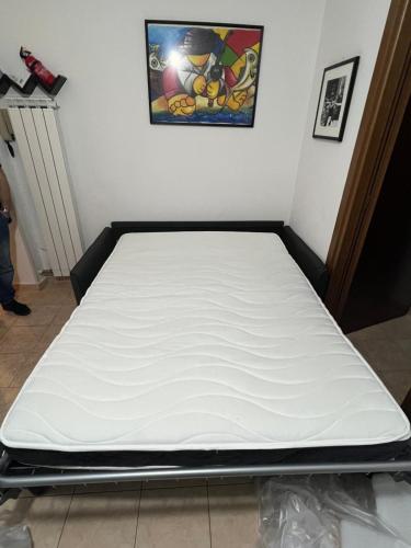 a mattress sitting on a bed frame in a room at Home & Breakfast La Madonnina 013136-CNI-00001 in Lurago D'Erba 