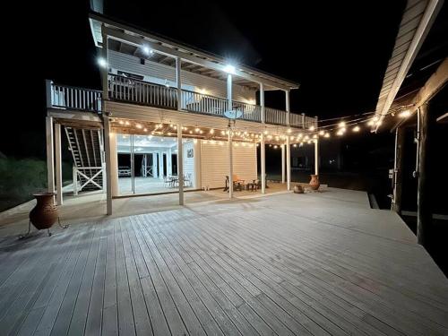 a large deck with lights on it at night at Getting Nauti at the Bay in Shoreline Park