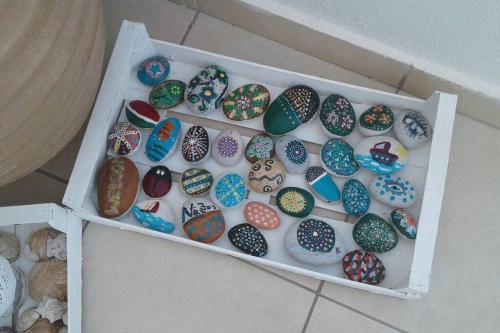 a box filled with lots of different colored eggs at Faro del mar in Naxos Chora