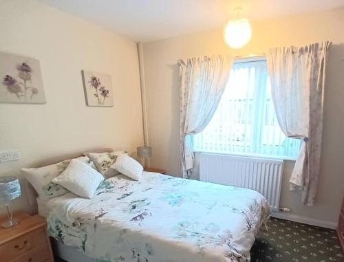a bedroom with a bed and a window at Bungalow in Shildon County Durham in Shildon