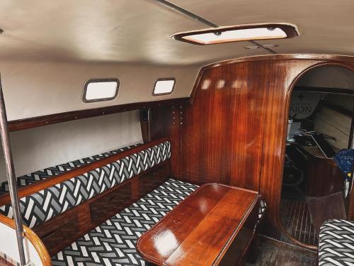 a wooden bench in the back of a boat at Star Guide AION in Izola