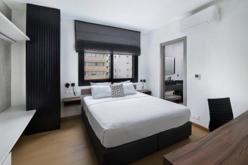 Letto o letti in una camera di Urban Habitat Executive Suites