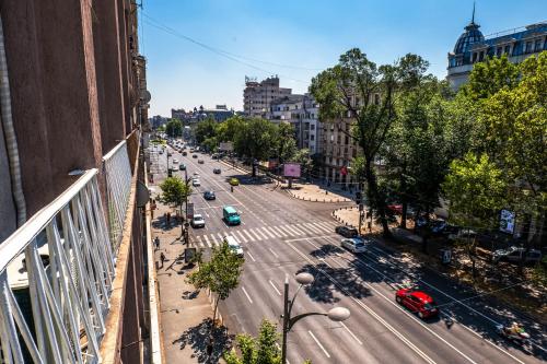 a view of a city street with cars on the road at Sunrise Apartments City Center in Bucharest