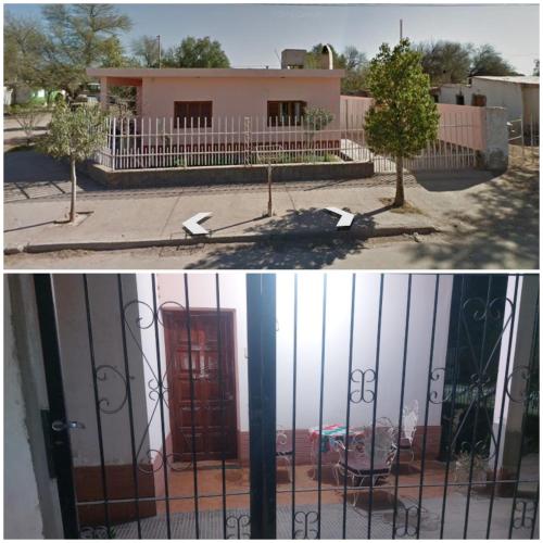 una puerta delante de una casa con una puerta roja en Hospedaje La Gringa en Tinogasta