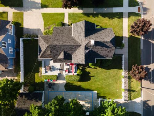 an aerial view of a house with a roof at For Pete's Sake - private pickleball court & 2 blocks to beach! in South Haven