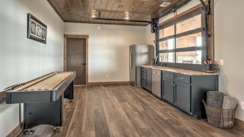 a large kitchen with a ping pong table in it at Boundless Views in Mashburn Mill