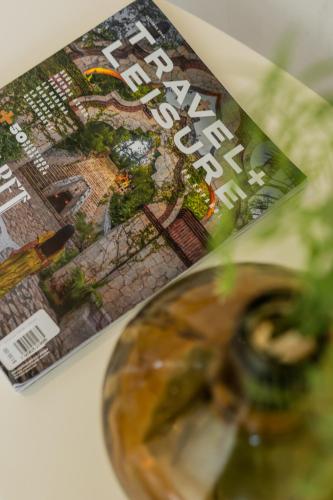 a magazine sitting on top of a table at *CASA ALUXES- Guesthouse* in Cancún