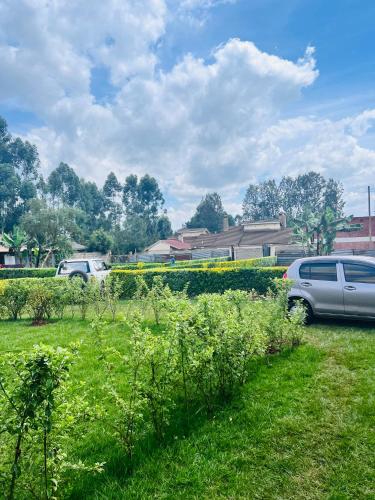 a car parked in a field of green grass at Kitale Heavenly Haven in Kitale