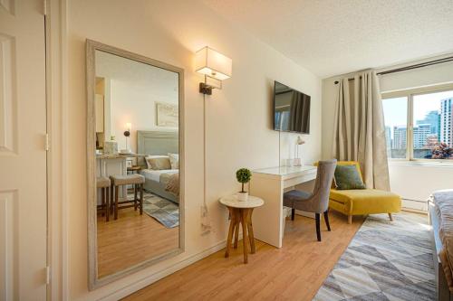 a hotel room with a bedroom and a living room at Luxury Downtown Studio King Bed City View in Seattle
