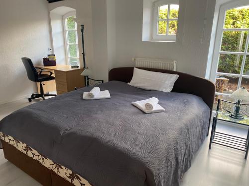 Giường trong phòng chung tại Ferienwohnungen Sieversdorf