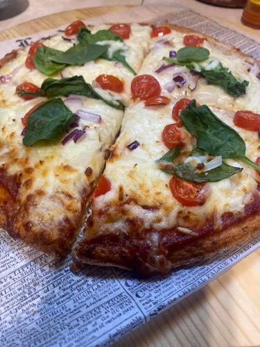 two slices of pizza sitting on top of a plate at Hacienda el Jibarito in San Sebastian