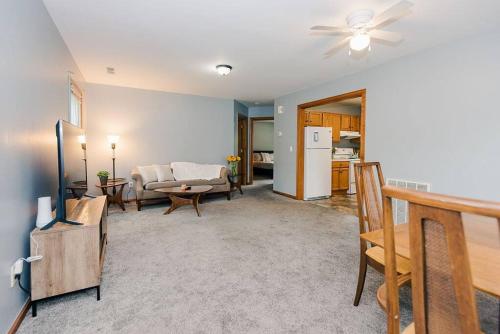 a living room with a couch and a table at Kinston Getaway #1 in Kinston
