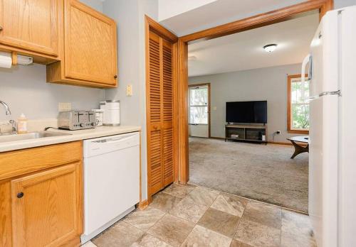 a kitchen with a sink and a dishwasher at Kinston Getaway #1 in Kinston